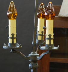 Detail of the three supports for the candle light sockets.